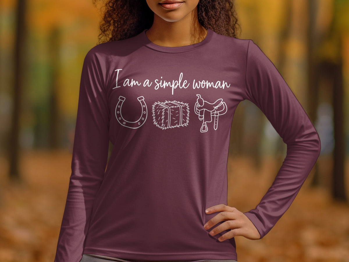 Maroon long-sleeve shirt with text "I am a simple woman" and horseshoe, hay bale, and saddle graphics.