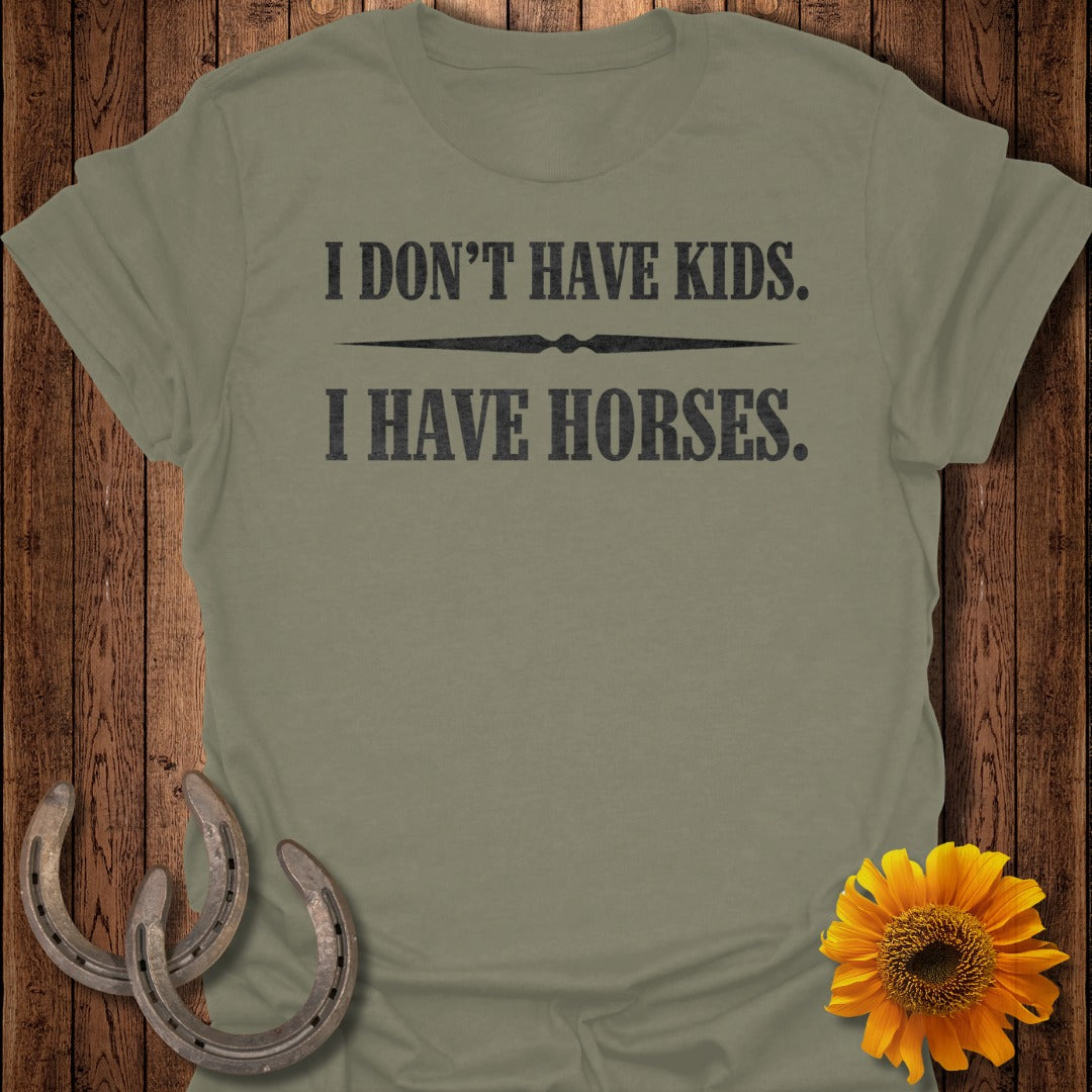 Olive green t-shirt with "I DON'T HAVE KIDS. I HAVE HORSES." text.