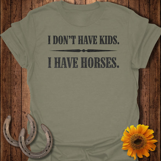 Olive green t-shirt with "I DON'T HAVE KIDS. I HAVE HORSES." text.