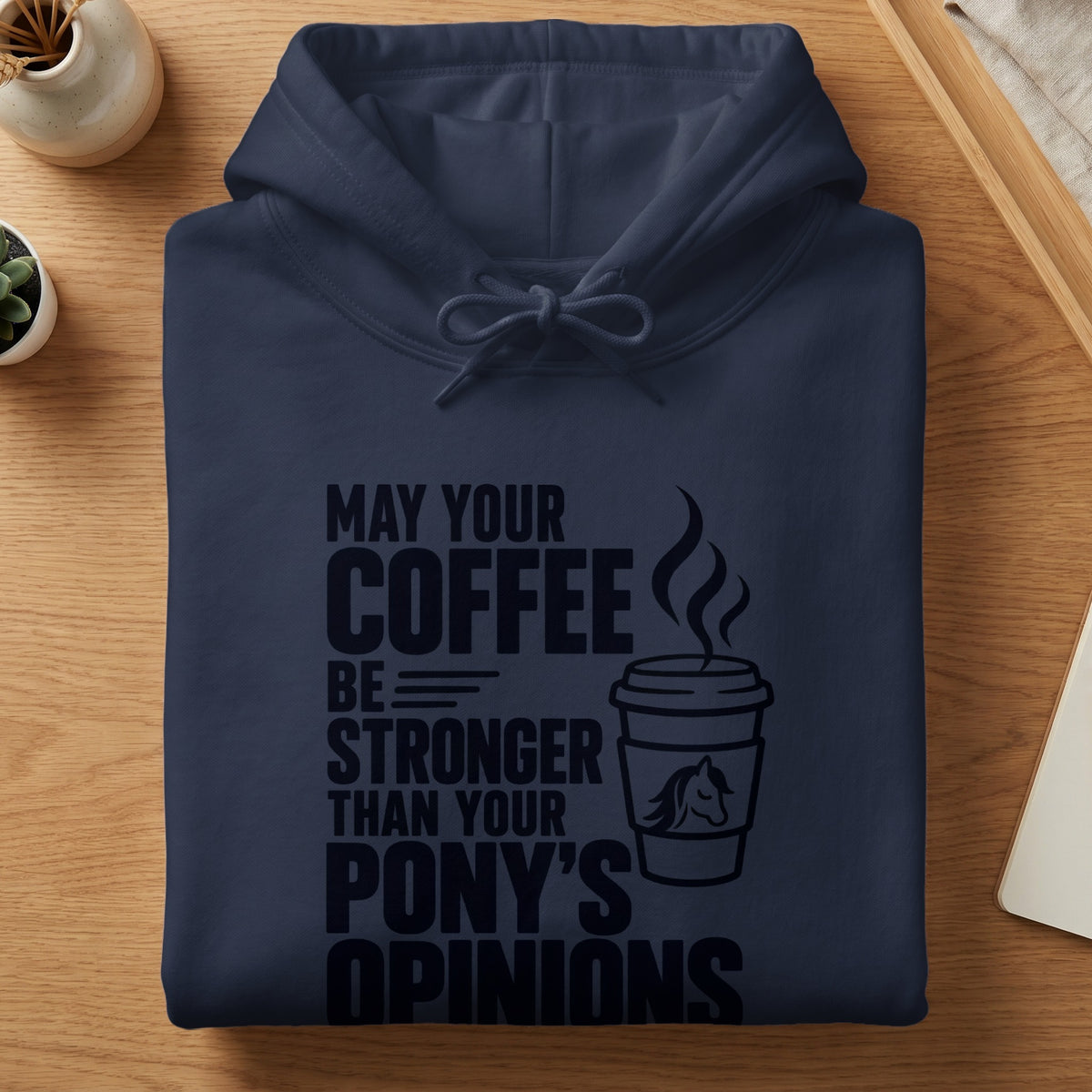 Navy hoodie with "May your coffee be stronger than your pony's opinions" text.