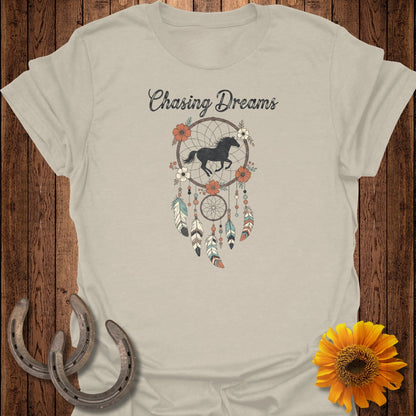 Light tan t-shirt with "Chasing Dreams" and a horse inside a dreamcatcher.