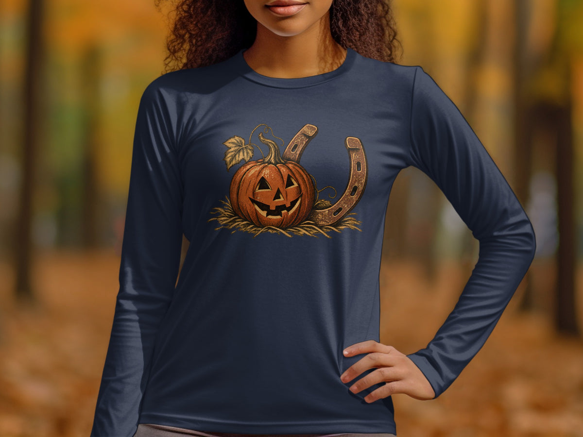Jack-o'-lantern with horseshoe and autumn leaves on dark blue long-sleeve shirt.