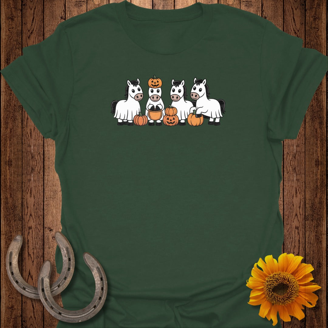 Four cartoon horses dressed as ghosts with pumpkins.