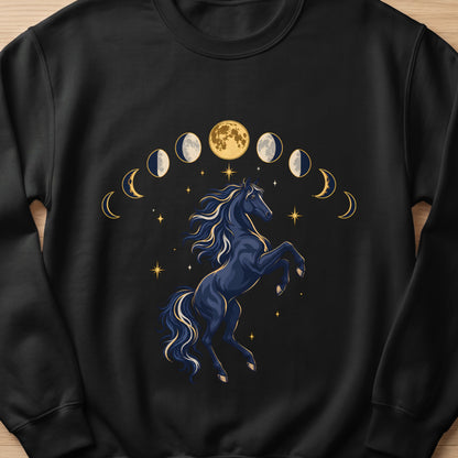 Dark blue horse rearing amidst moon phases and scattered stars graphic on black sweatshirt.