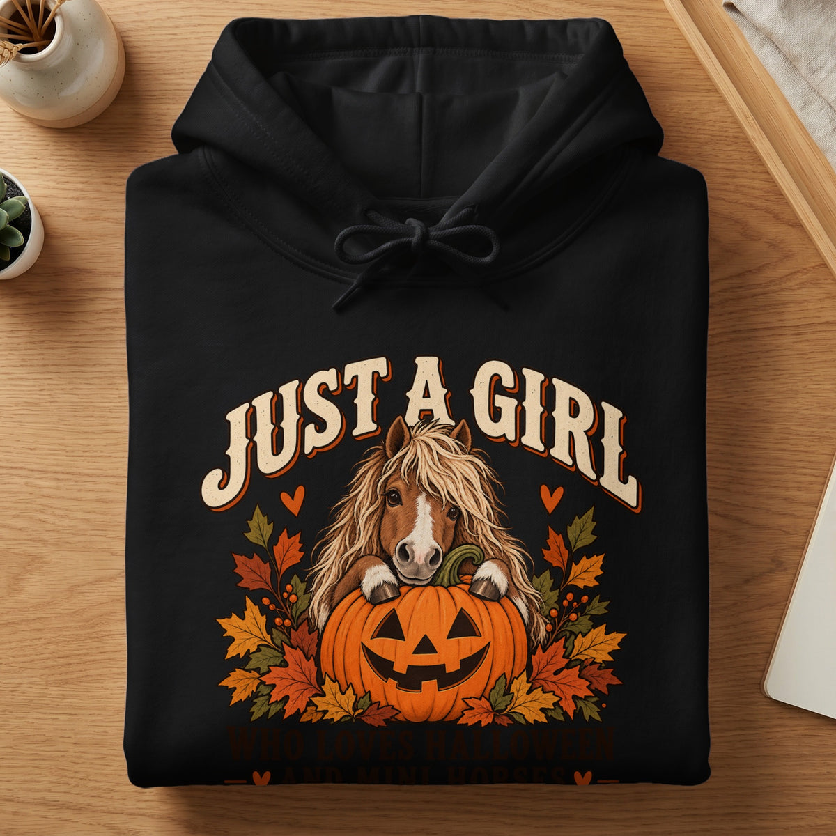 Black hoodie with "Just a girl who loves Halloween and mini horses" text and horse on pumpkin graphic.