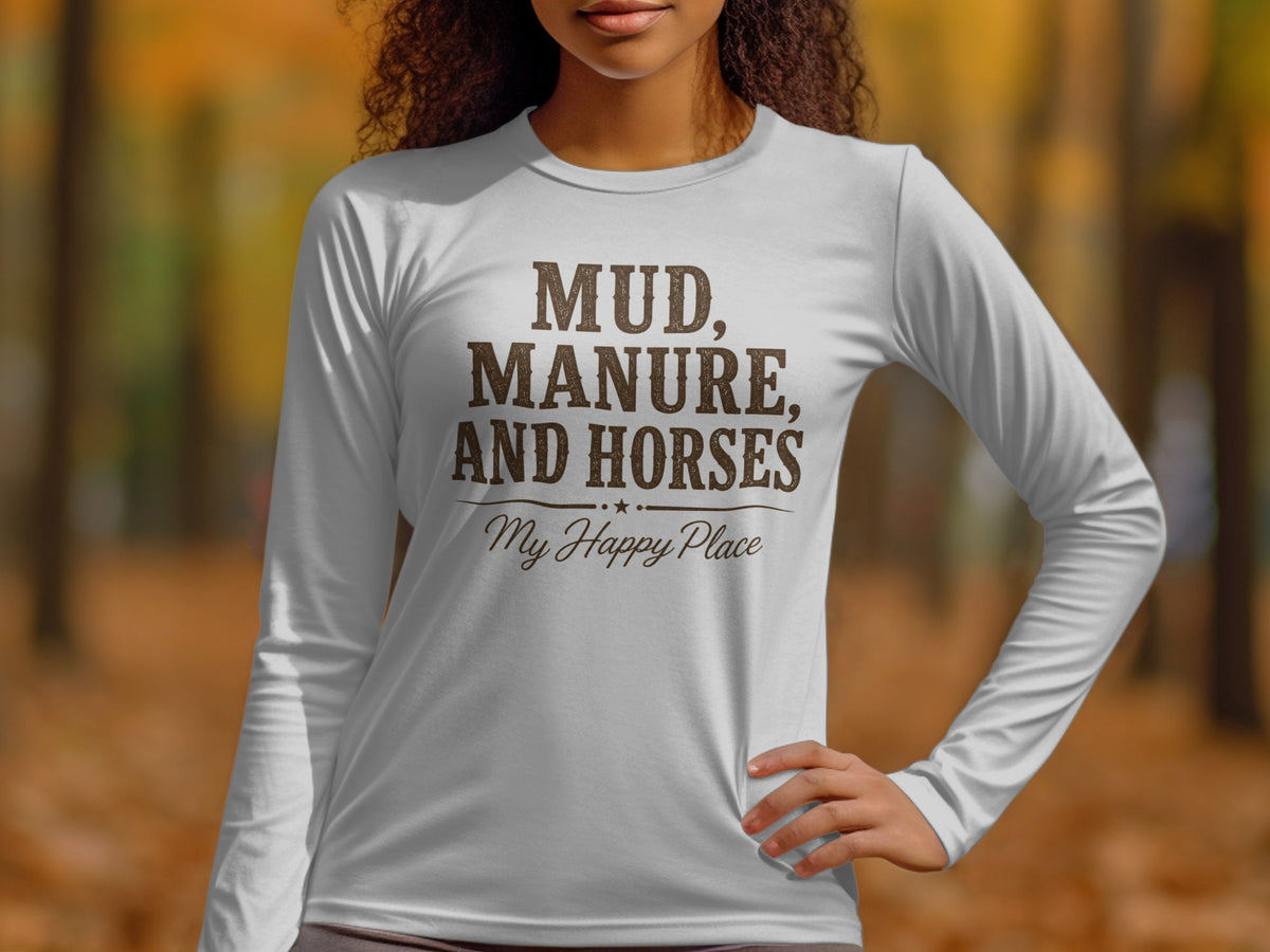 White long-sleeve shirt with brown text reading "MUD, MANURE, AND HORSES My Happy Place."