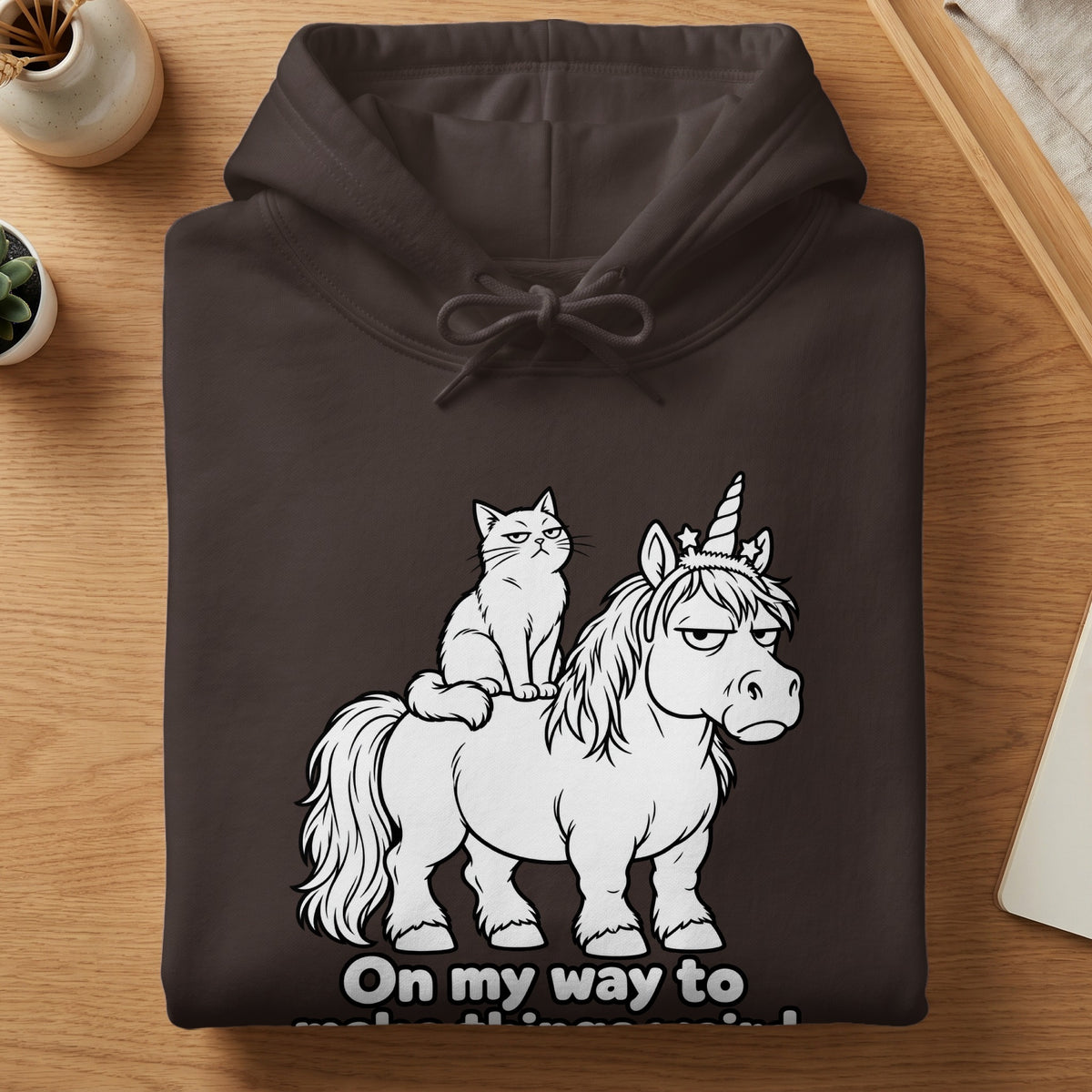 Brown hoodie with a grumpy cat riding a unicorn and text "On my way to".
