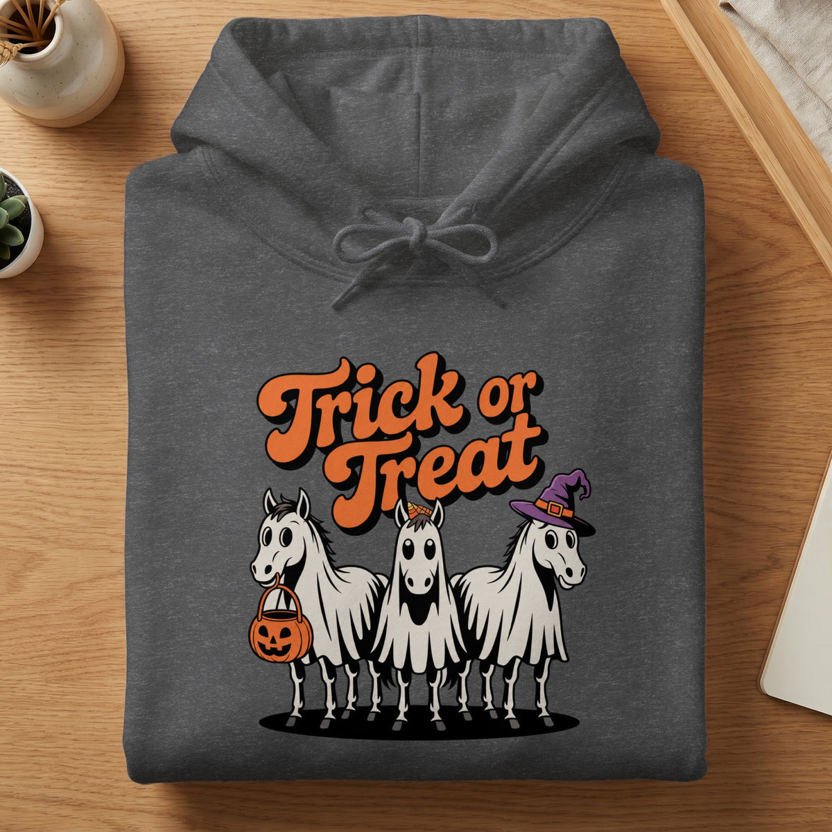 Gray hoodie with "Trick or Treat" text and three horses dressed as ghosts.