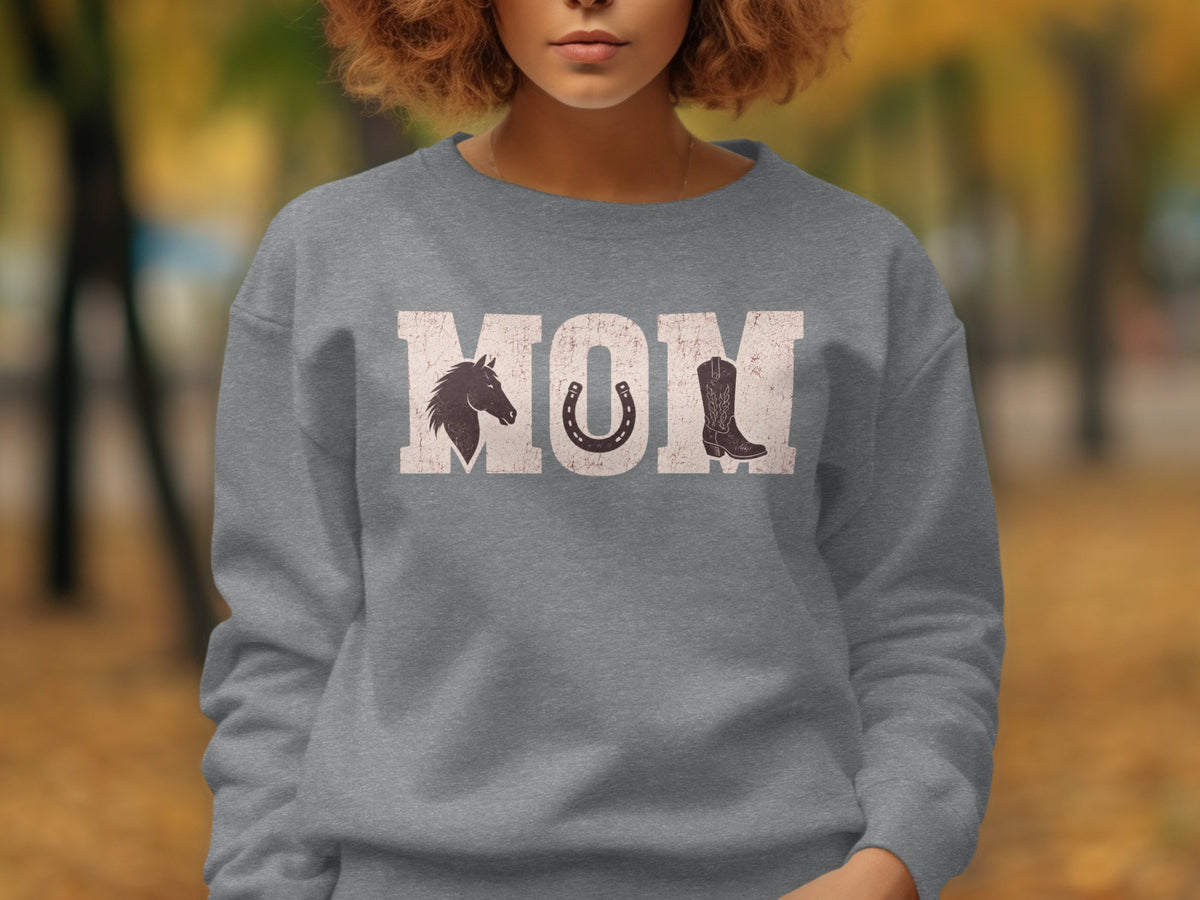 Grey sweatshirt with "MOM" text featuring horse, horseshoe, and cowboy boot graphics.