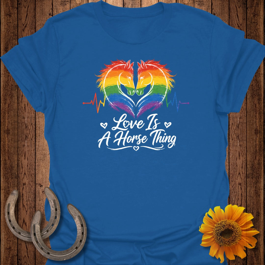 Blue t-shirt with rainbow horse heads in heart shape and "Love Is A Horse Thing" text.