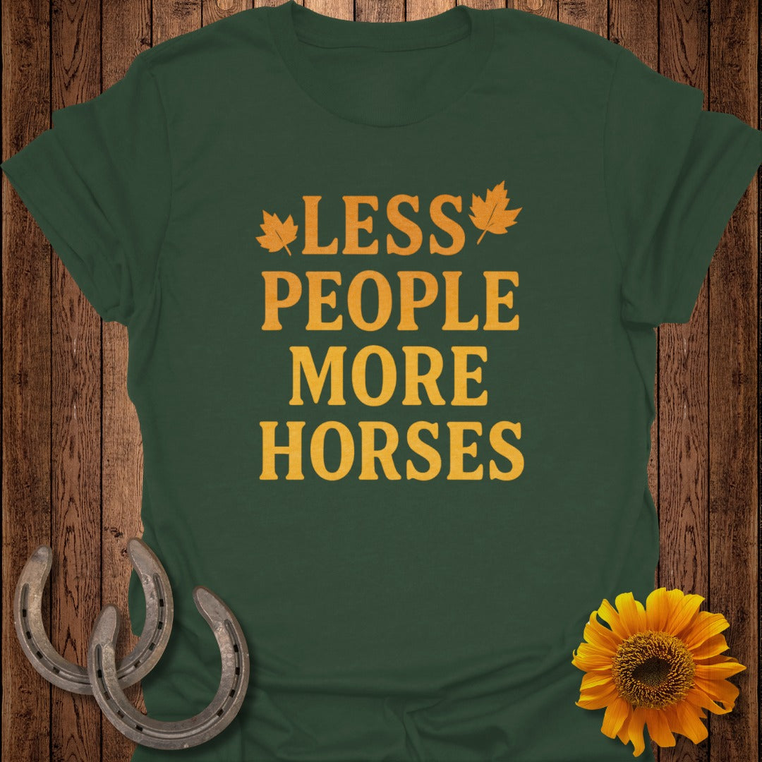 Green t-shirt with orange text "Less People More Horses" and decorative elements.