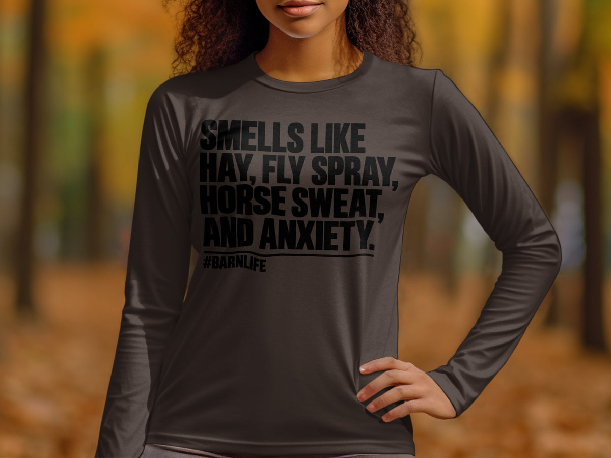 Long-sleeve shirt with "Smells like Hay, Fly Spray, Horse Sweat, and Anxiety. #Barnlife" text.