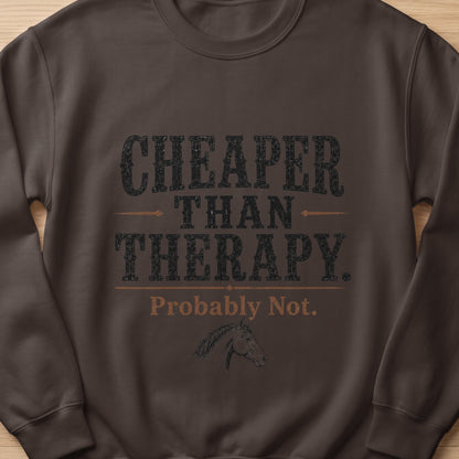 Dark brown sweatshirt with "Cheaper Than Therapy. Probably Not." text and horse graphic.