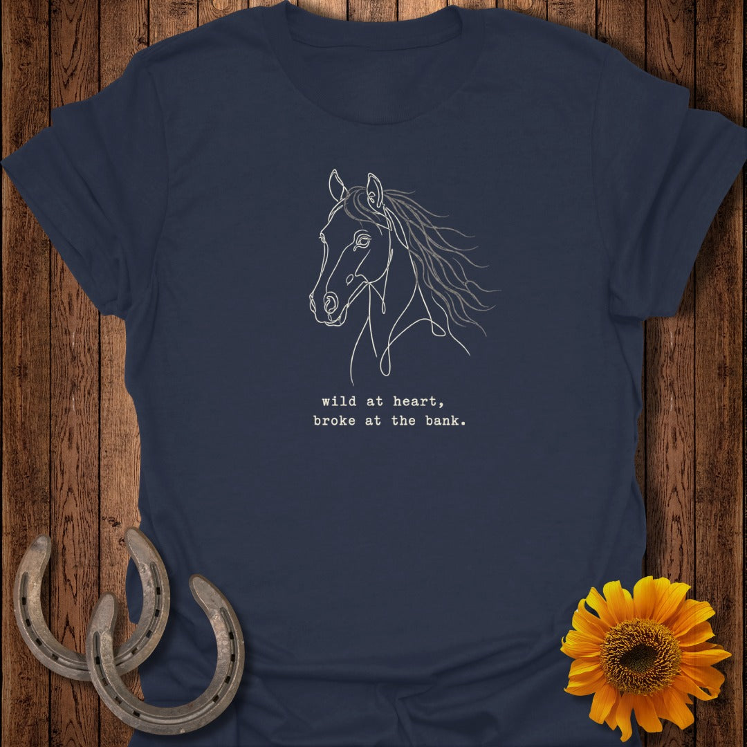 Navy t-shirt with white line drawing of a horse's head and text "wild at heart, broke at the bank."