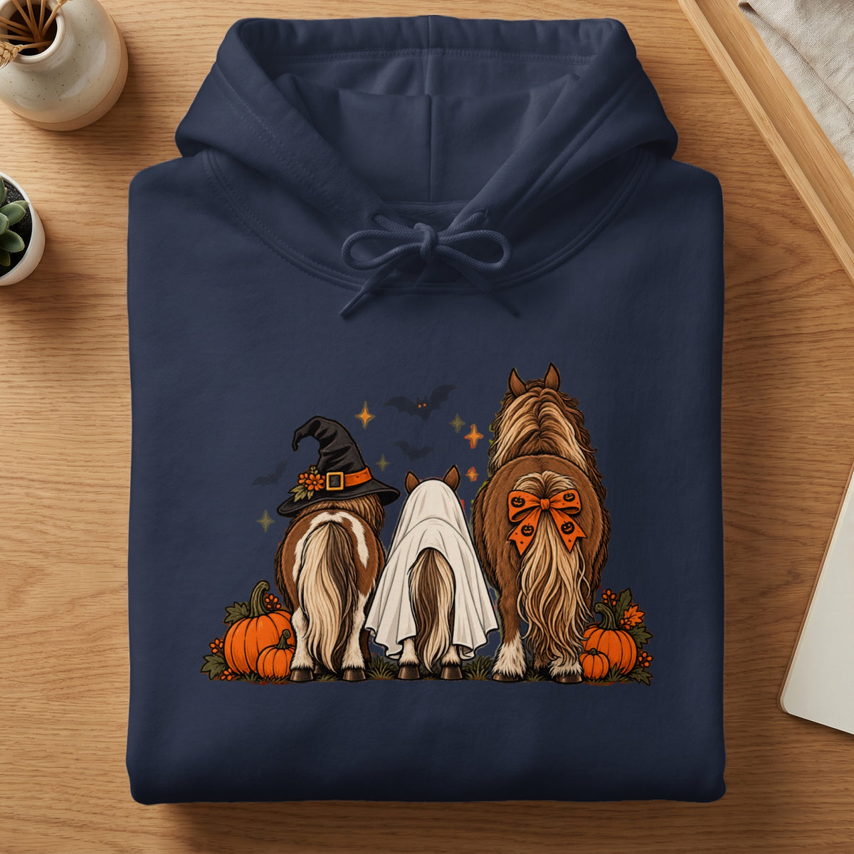 Three horses in Halloween costumes: witch hat, ghost, and pumpkin bow.