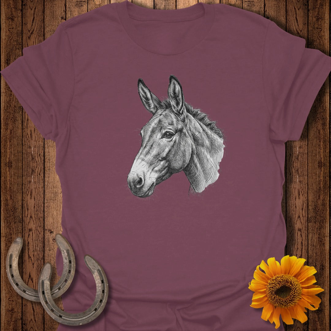 T-shirt with a black and white drawing of a mule's head and two horseshoes.