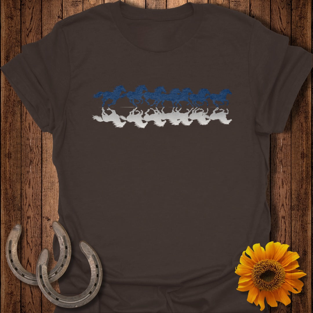 Brown t-shirt with blue and white running horses and their reflections.
