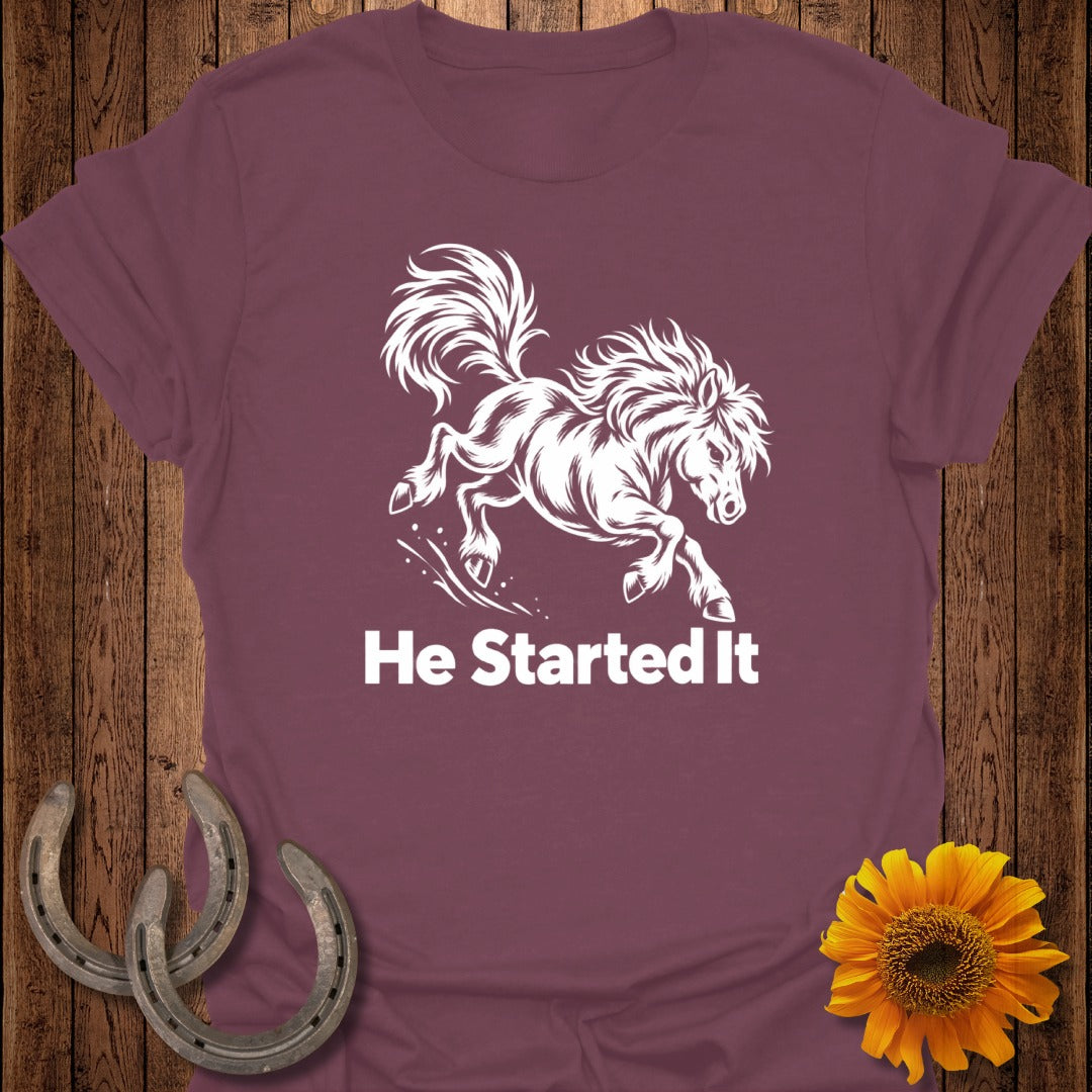 Maroon t-shirt with a white leaping horse graphic and text "He Started It".