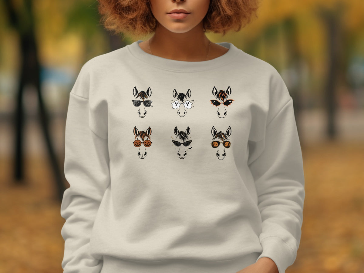 Cream sweatshirt with six Halloween-themed horse graphics, each wearing different glasses.