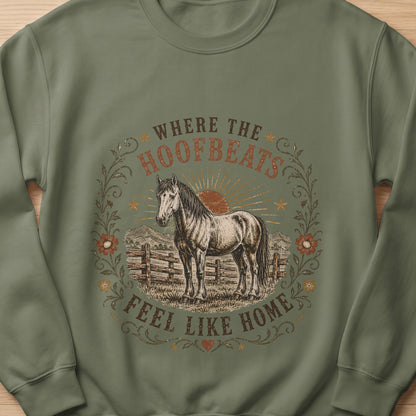 Horse graphic with text "Where the Hoofbeats Feel Like Home" on a green sweatshirt.