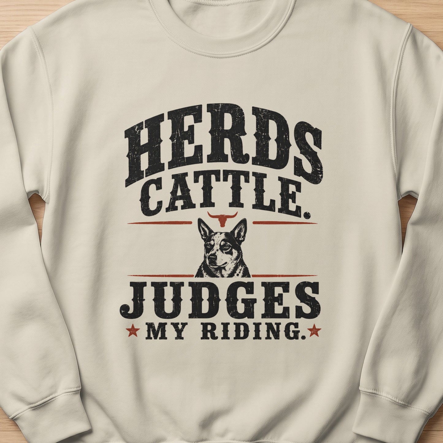 Cream sweatshirt with black distressed text and image of a dog and bull horns.