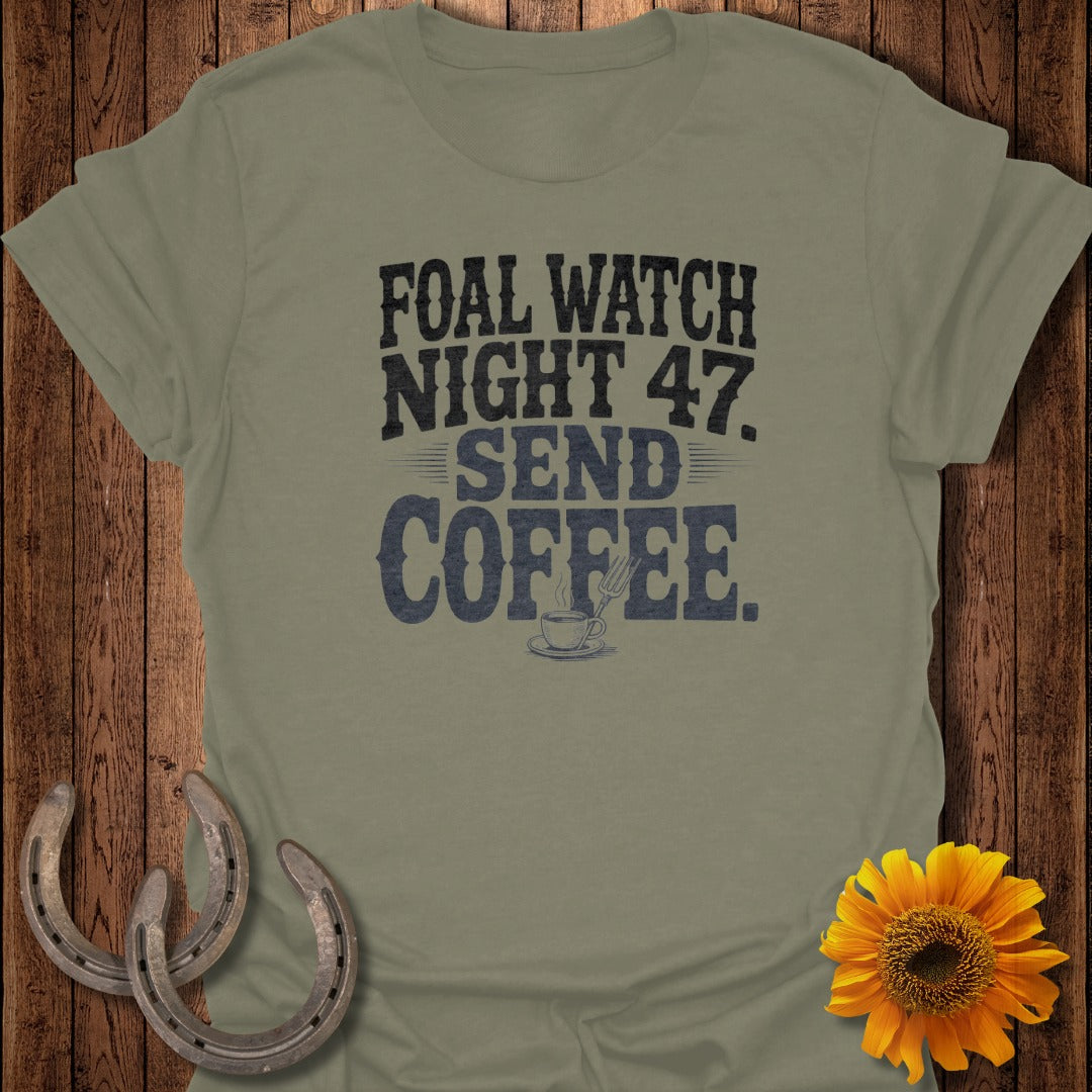T-shirt with text "FOAL WATCH NIGHT 47. SEND COFFEE." and a coffee cup.