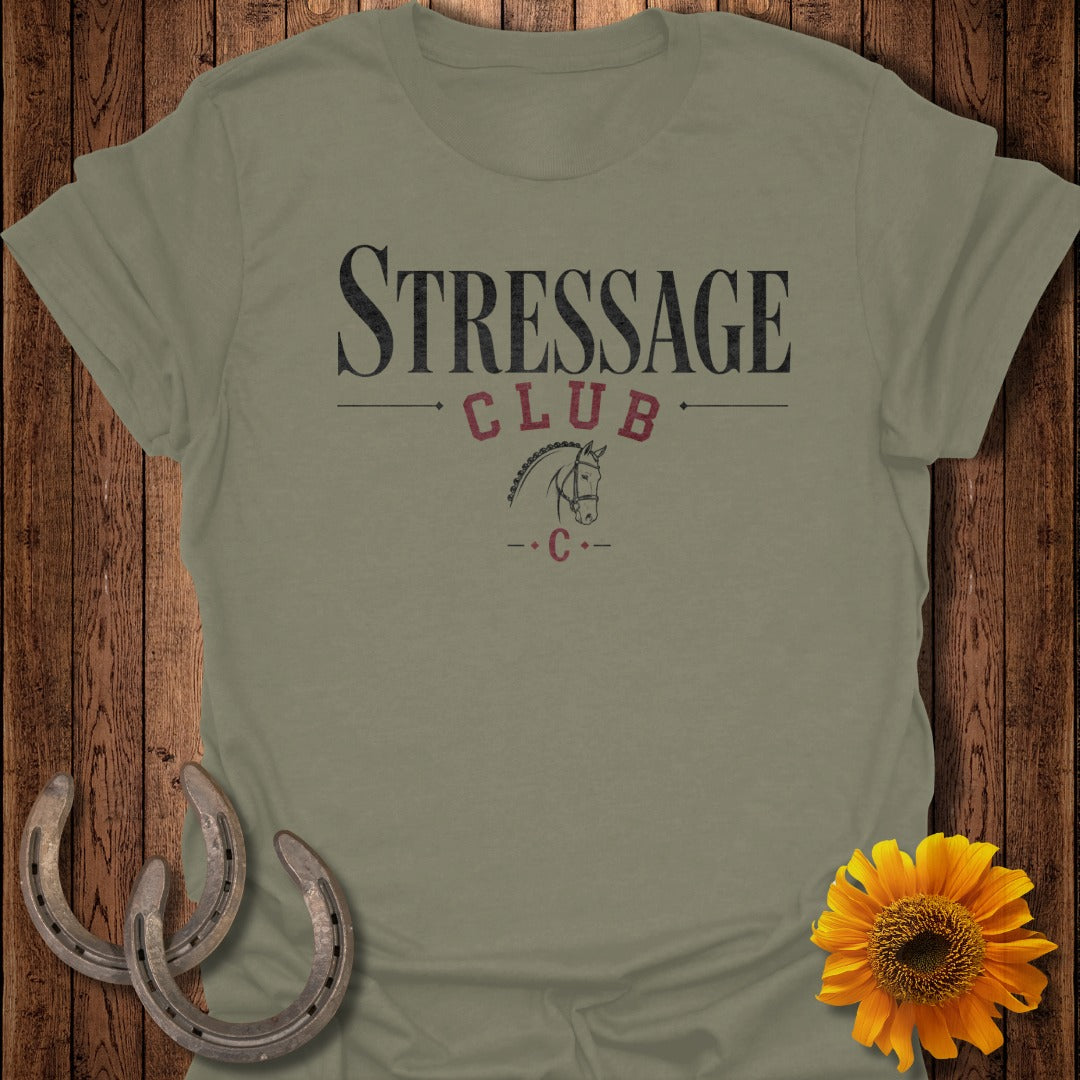 Olive green t-shirt with "STRESSAGE CLUB" text and horse graphic.