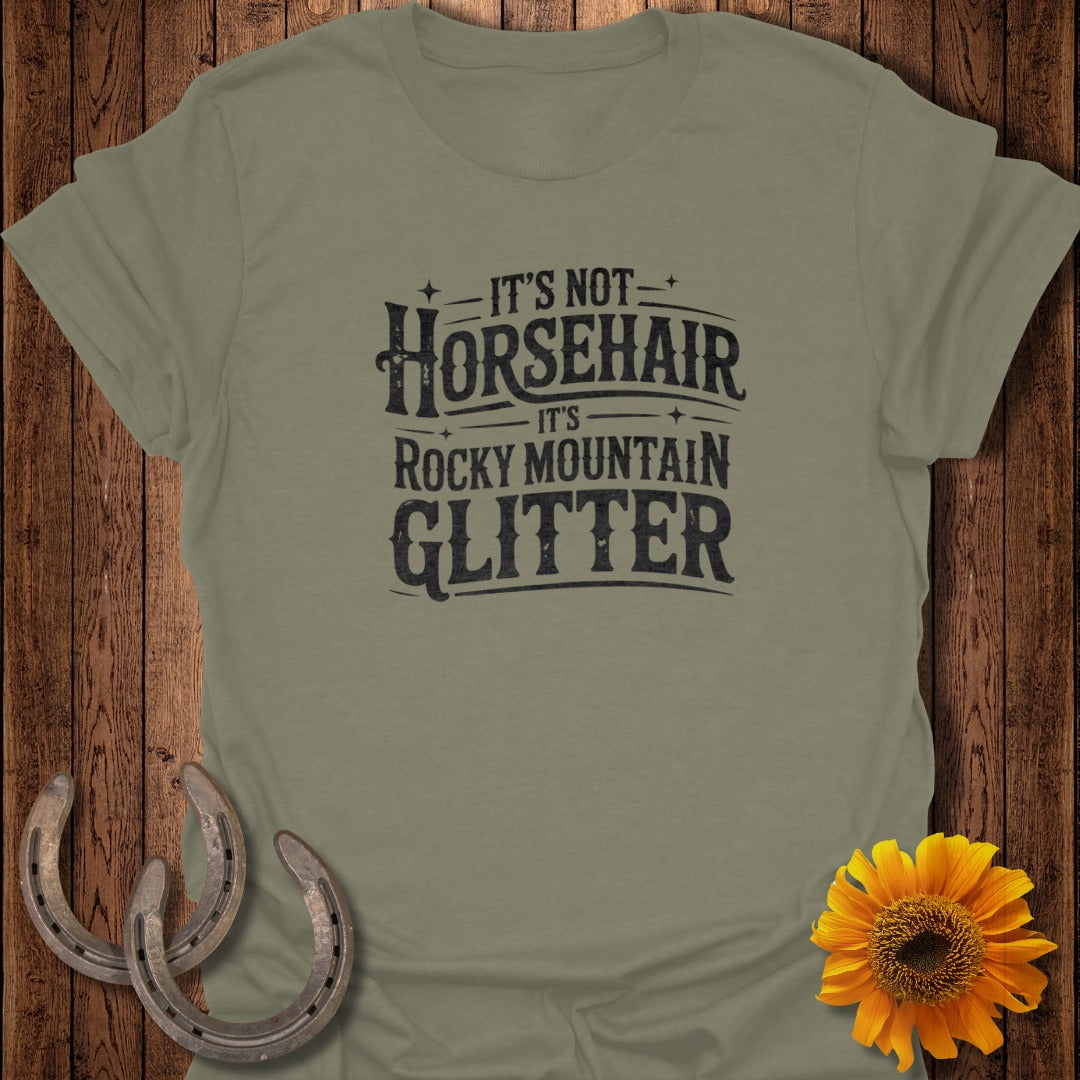 Olive t-shirt with text "It's Not Horsehair, It's Rocky Mountain Glitter".