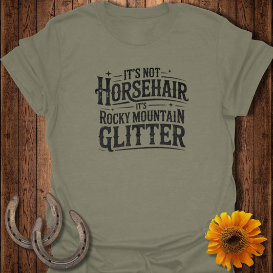 Olive t-shirt with text "It's Not Horsehair, It's Rocky Mountain Glitter".