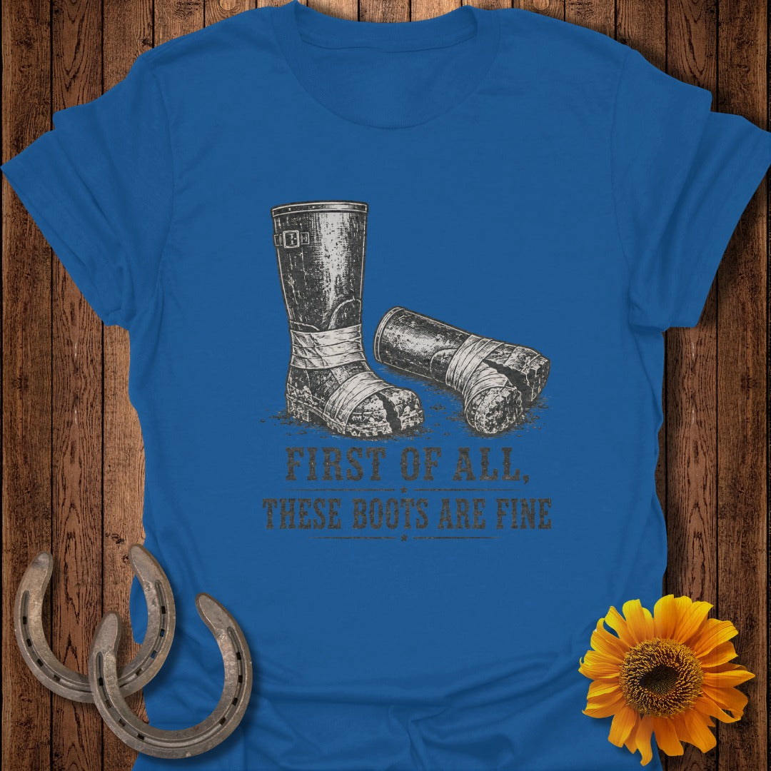 Blue t-shirt graphic with distressed boots and text "FIRST OF ALL, THESE BOOTS ARE FINE".