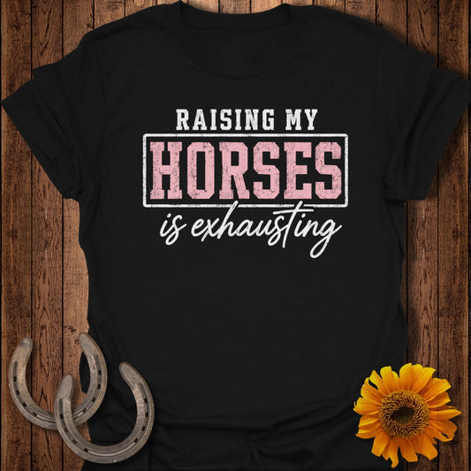 Black t-shirt with text "RAISING MY HORSES is exhausting" and horseshoe and sunflower accents.