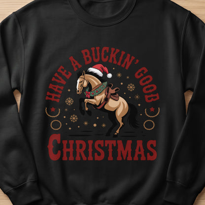 Christmas sweatshirt with a bucking horse wearing a Santa hat and wreath, reading "Have a Buckin' Good Christmas".