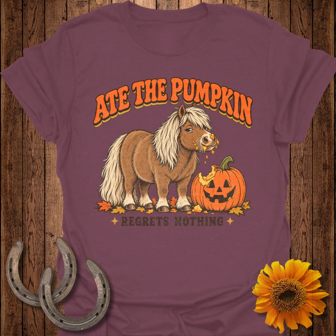 Brown pony eating a pumpkin with text "Ate the pumpkin" and "regrets nothing".