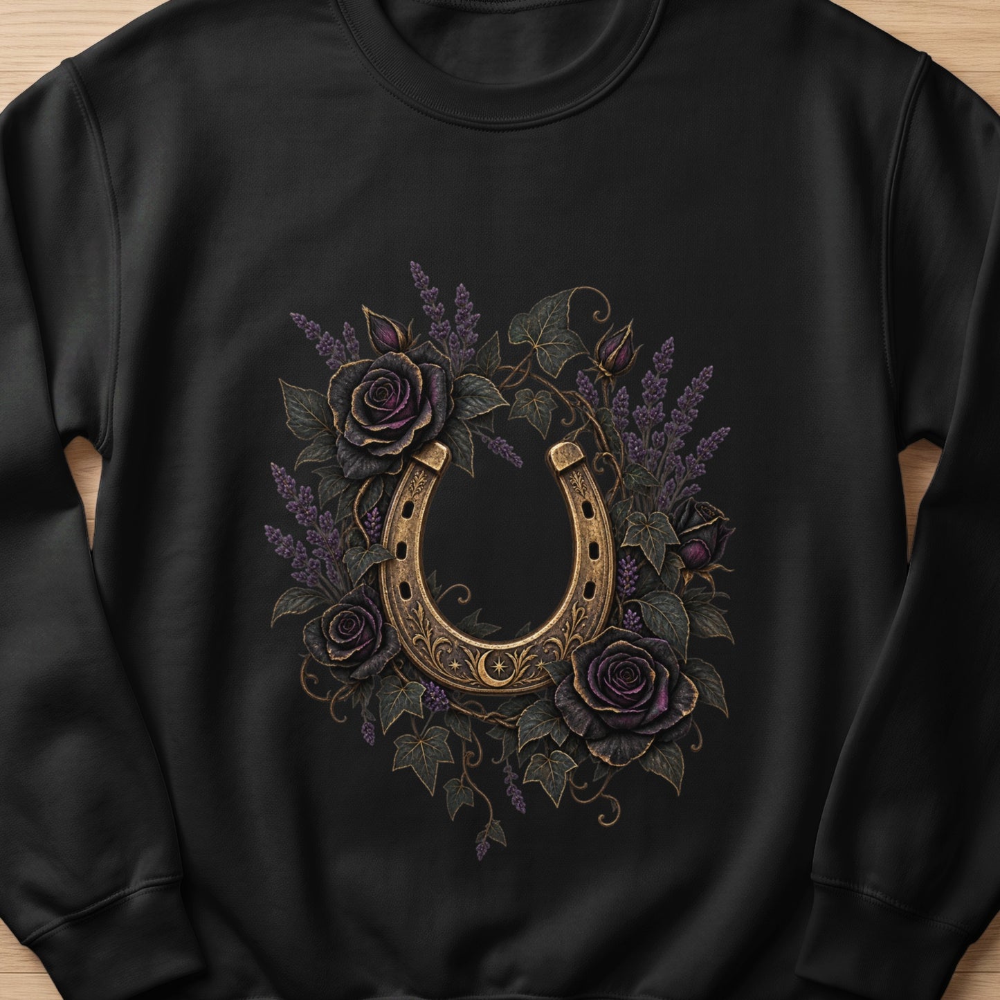 Black sweatshirt with ornate golden horseshoe and dark purple roses.