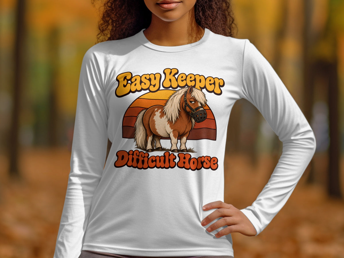 White long-sleeve shirt with "Easy Keeper Difficult Horse" text and cartoon pony graphic.