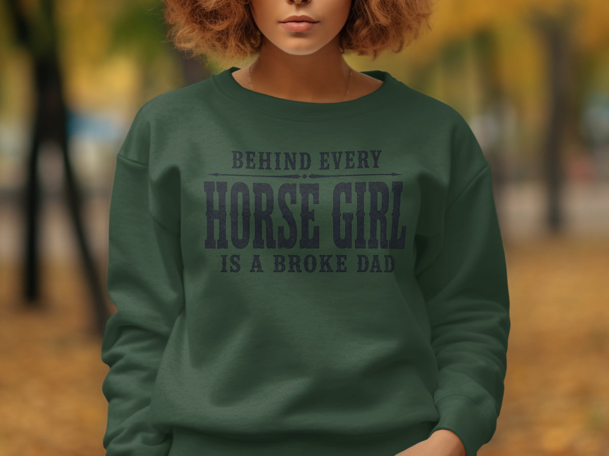 Green sweatshirt with "Behind Every Horse Girl Is A Broke Dad" text.