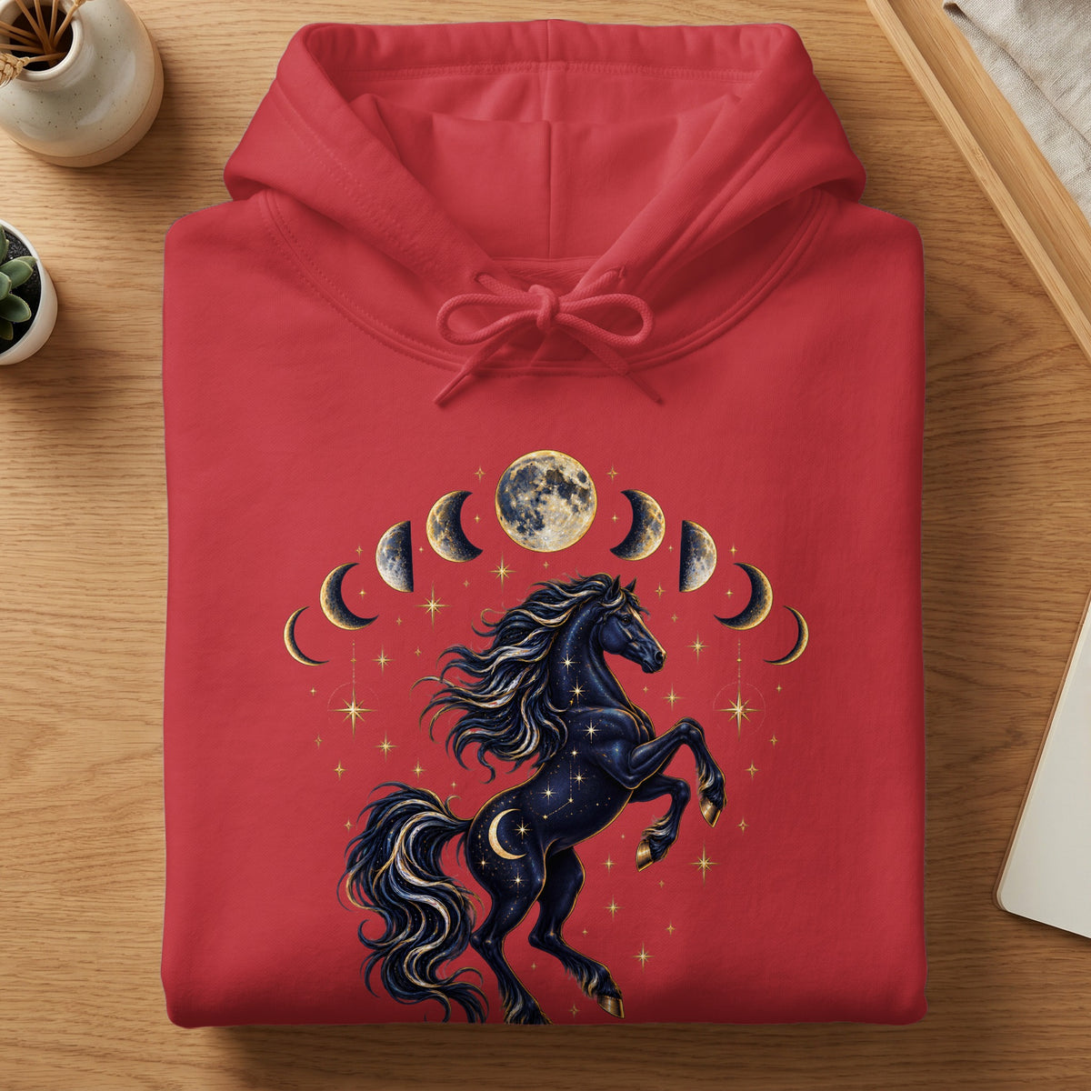 Red hoodie with a black celestial horse and moon phase graphic.