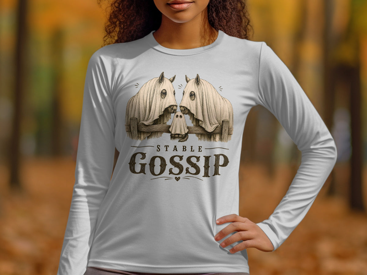 White long-sleeve shirt with a graphic of two horses in ghost costumes and "Stable Gossip" text.