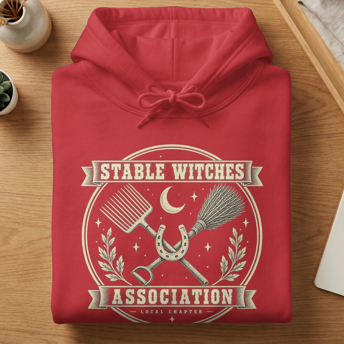 Red hoodie with "Stable Witches Association Local Chapter" text and graphic.