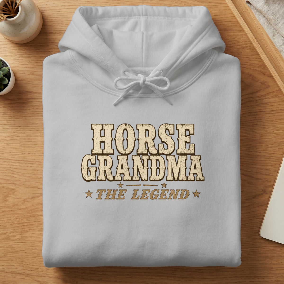 White hoodie with "HORSE GRANDMA THE LEGEND" text in distressed golden font.