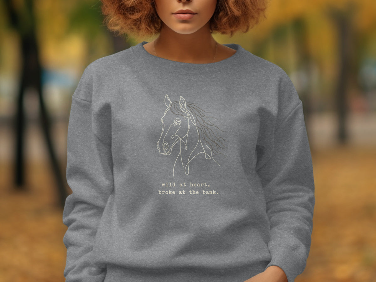 Grey sweatshirt with a white line drawing of a horse and text.