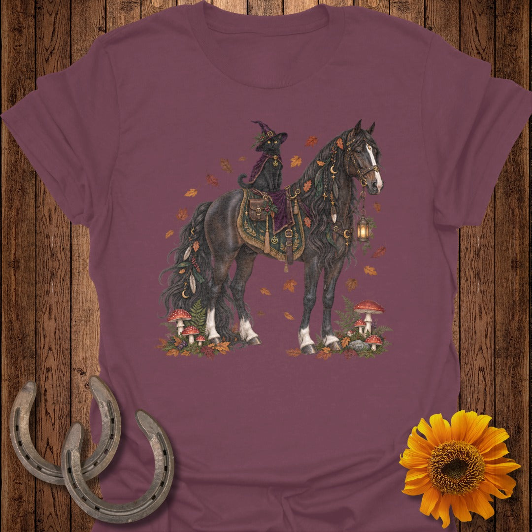 Black cat in witch hat rides a dark horse adorned with feathers and moons.