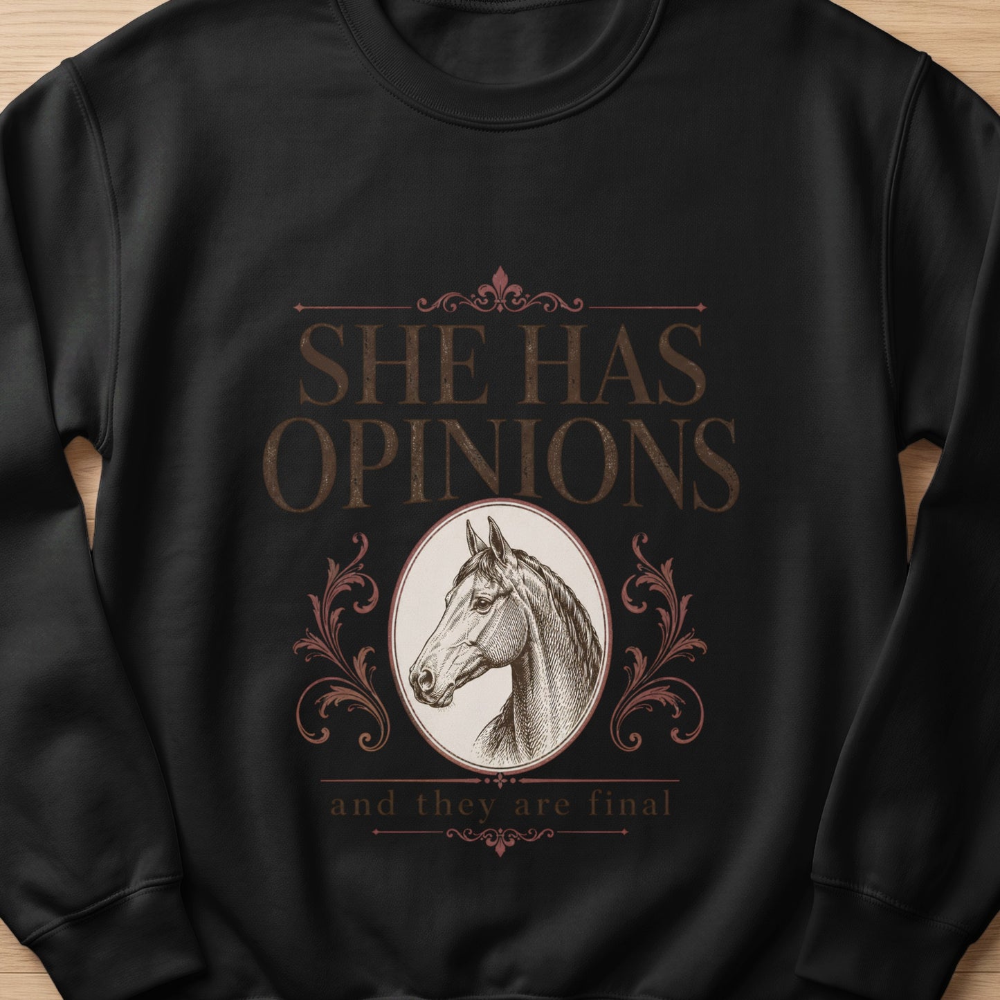 Black sweatshirt with "She Has Opinions" and horse graphic.