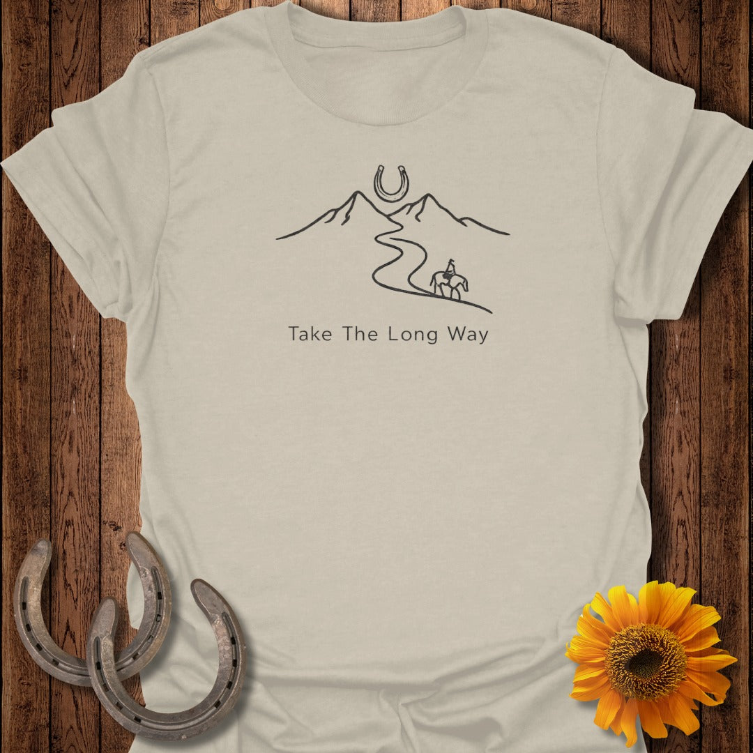 T-shirt with minimalist design of mountains, horse and rider, and horseshoe.