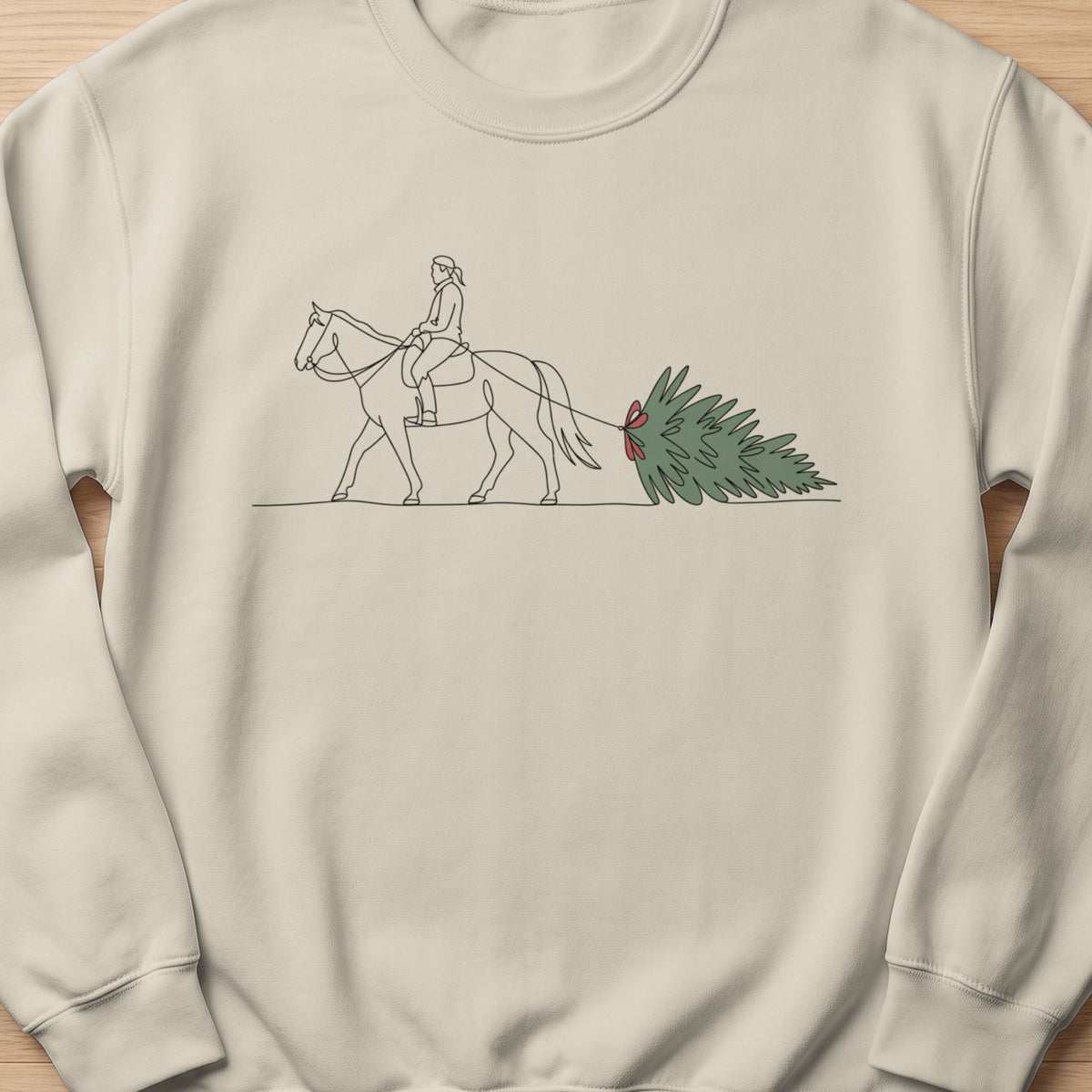Line art of person on horse pulling a Christmas tree with red bow.