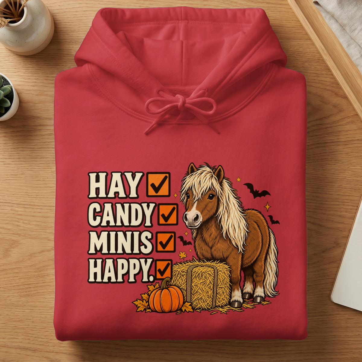 Red hoodie with "Hay, Candy, Minis, Happy" checklist, pony, pumpkin, and bats.