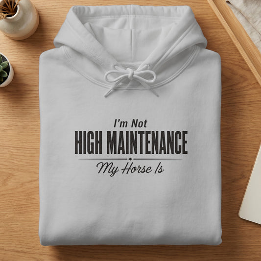 White hoodie with "I'm Not High Maintenance My Horse Is" text.