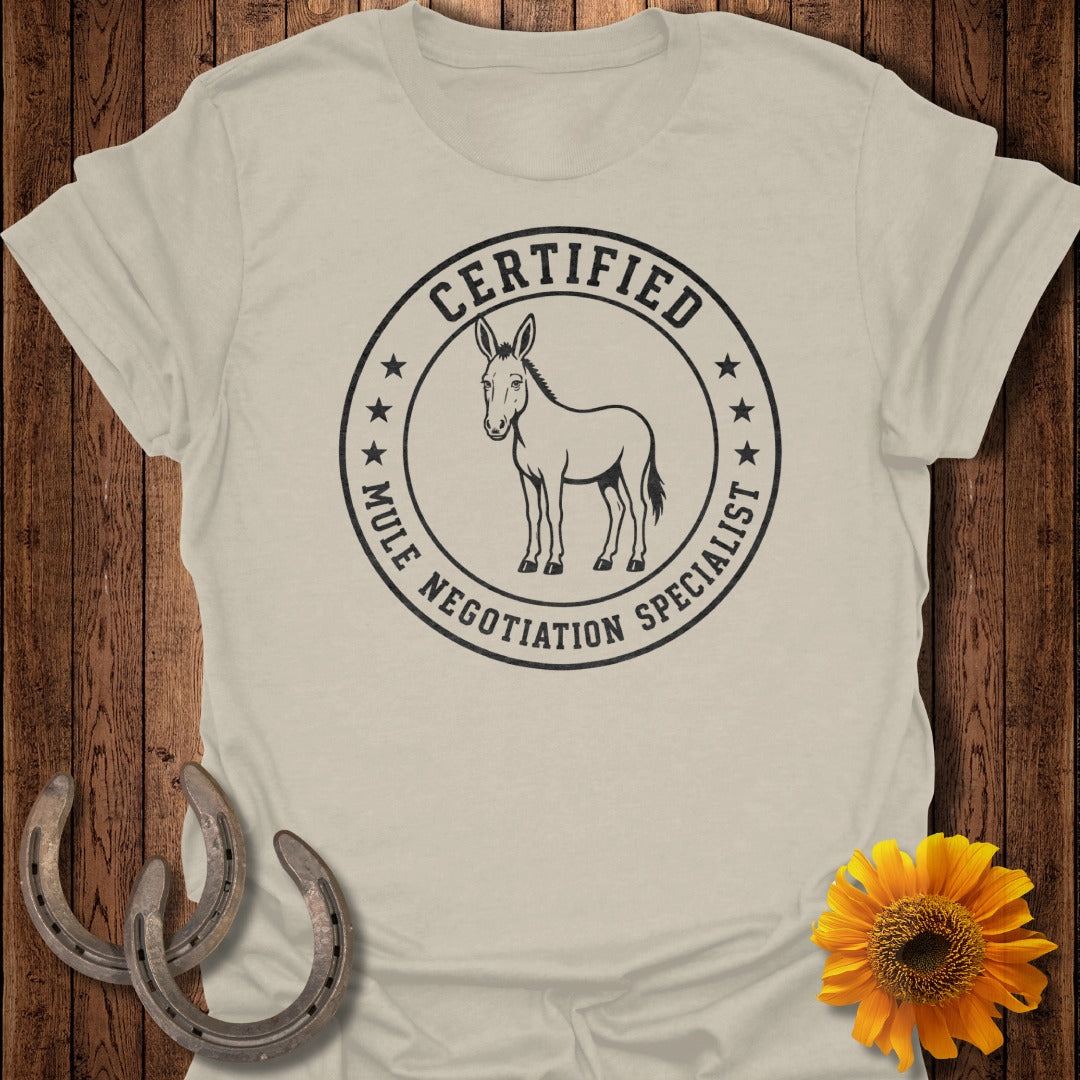 "Certified Mule Negotiation Specialist" t-shirt with a donkey graphic and stars.