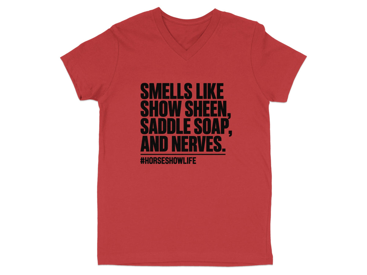 Red v-neck t-shirt with black text: "Smells like show sheen, saddle soap, and nerves. #horsesshowlife."