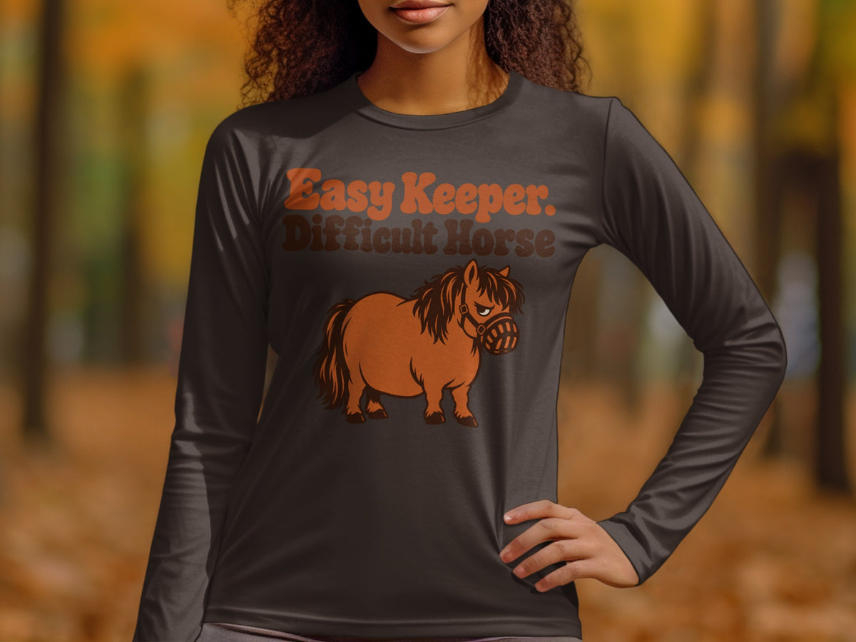Long-sleeve shirt with "Easy Keeper. Difficult Horse." text and cartoon horse.